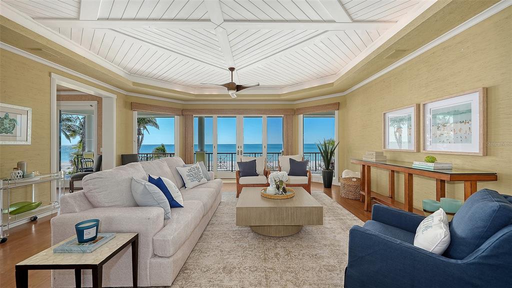 6477 Gulfside Road Longboat Key, FL 34228 - Photo 16 of 65 a living room with furniture and a large window