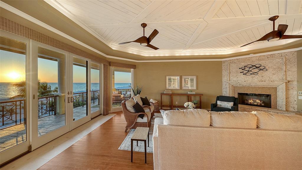 6477 Gulfside Road Longboat Key, FL 34228 - Photo 19 of 65 a living room with furniture and a fireplace