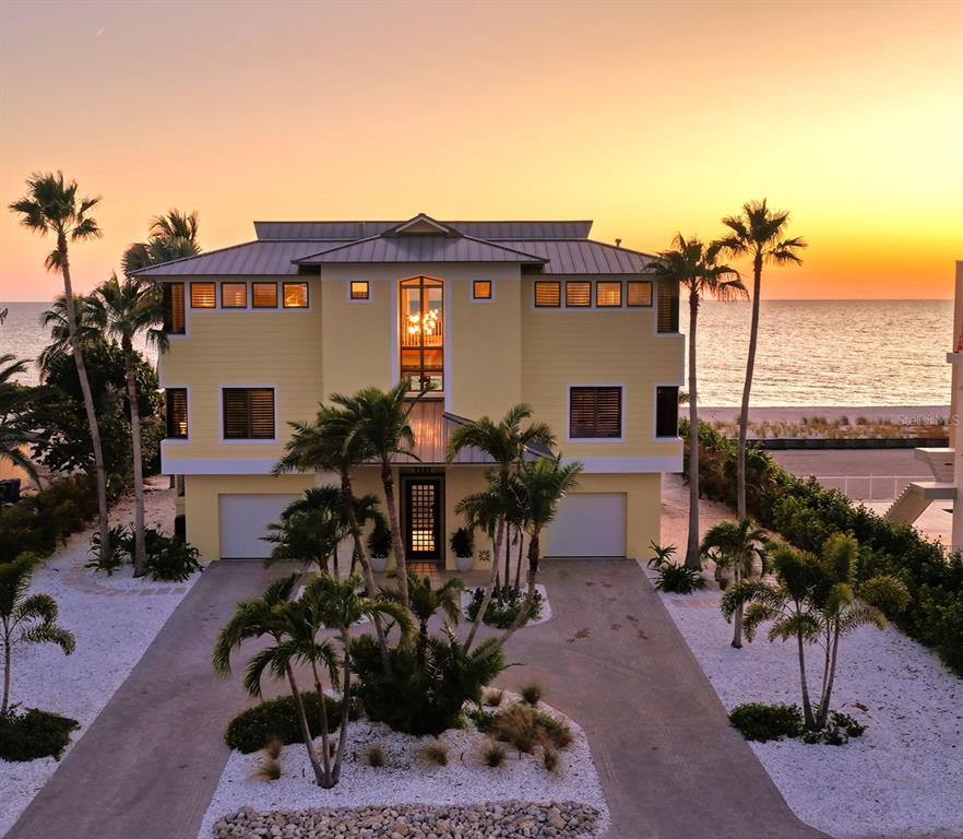 6477 Gulfside Road Longboat Key, FL 34228 - Photo 2 of 65 a view of a house with patio