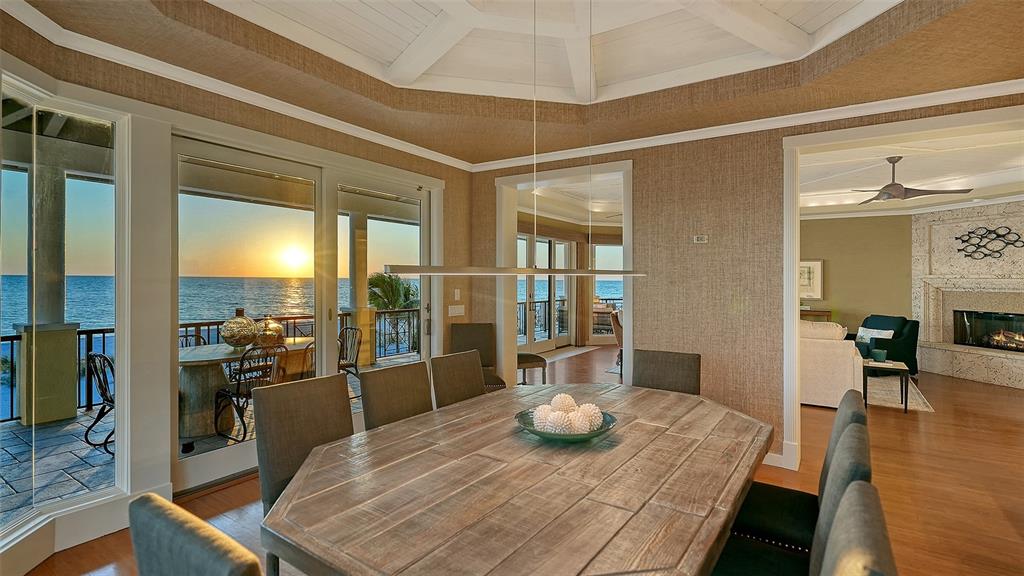 6477 Gulfside Road Longboat Key, FL 34228 - Photo 23 of 65 a view of a dining room with furniture