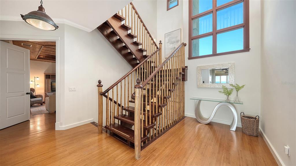 6477 Gulfside Road Longboat Key, FL 34228 - Photo 28 of 65 a view of entryway and hall with wooden floor