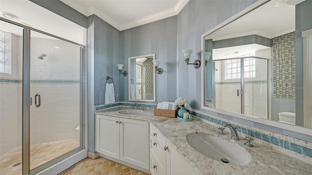 6477 Gulfside Road Longboat Key, FL 34228 - Photo 31 of 65 a bathroom with a granite countertop sink mirror and double