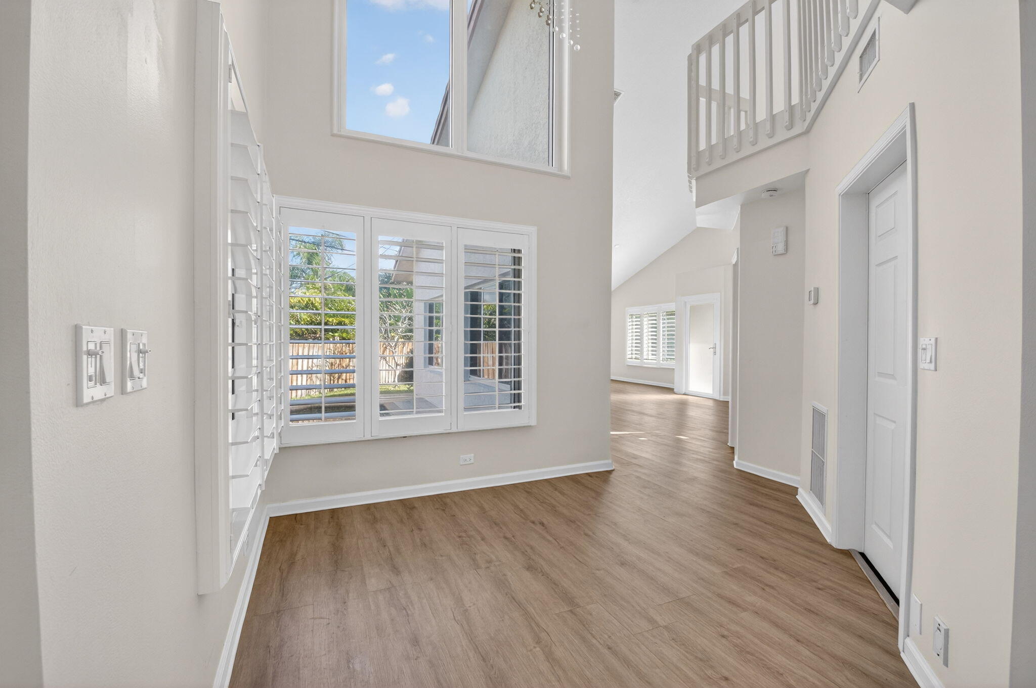 4517 Northwest 5th Avenue Boca Raton, FL 33431 - Photo 15 of 40 a view of an empty room with wooden floor and a window