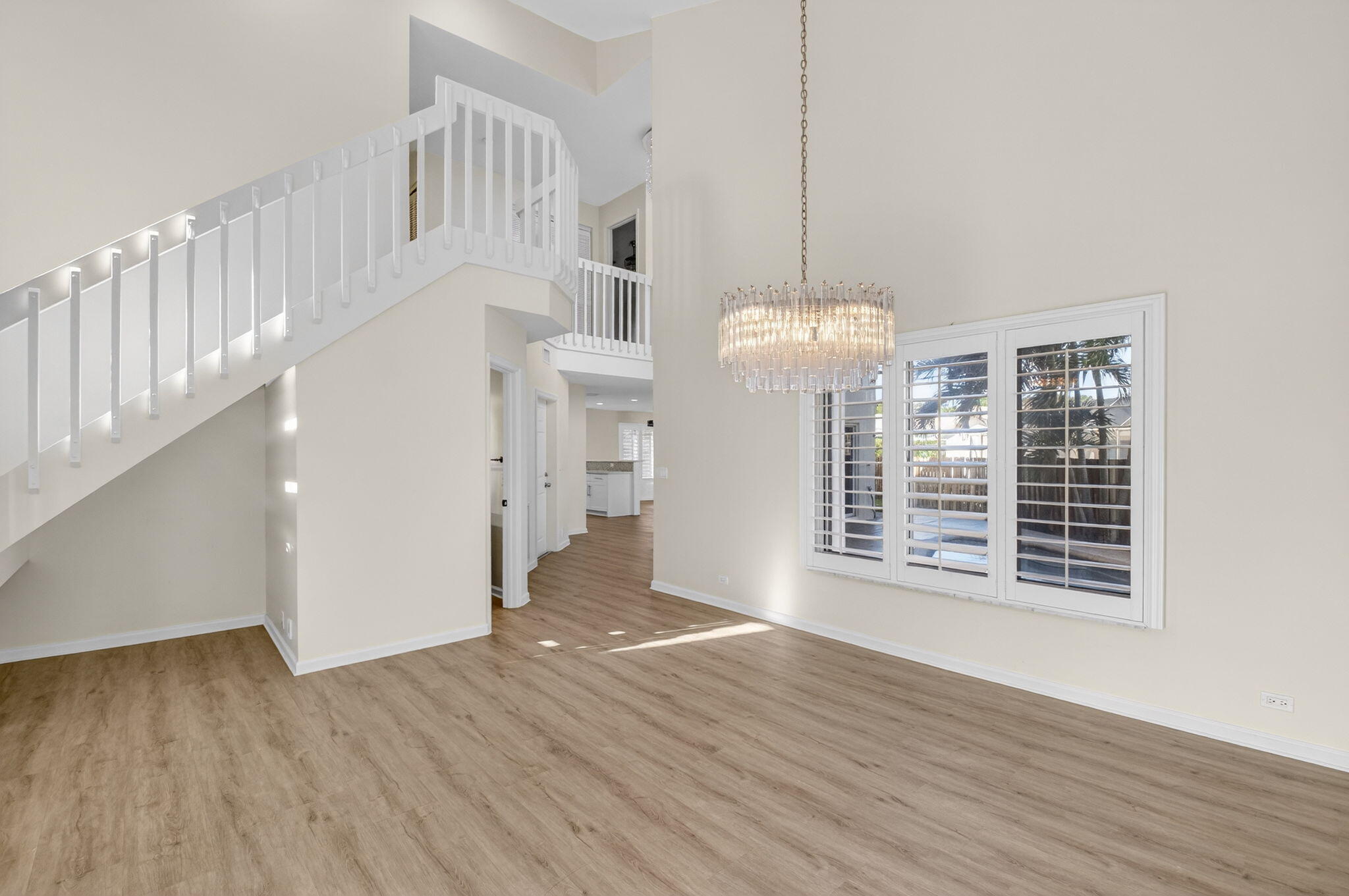 4517 Northwest 5th Avenue Boca Raton, FL 33431 - Photo 18 of 40 a view of a livingroom with wooden floor and a ceiling fan
