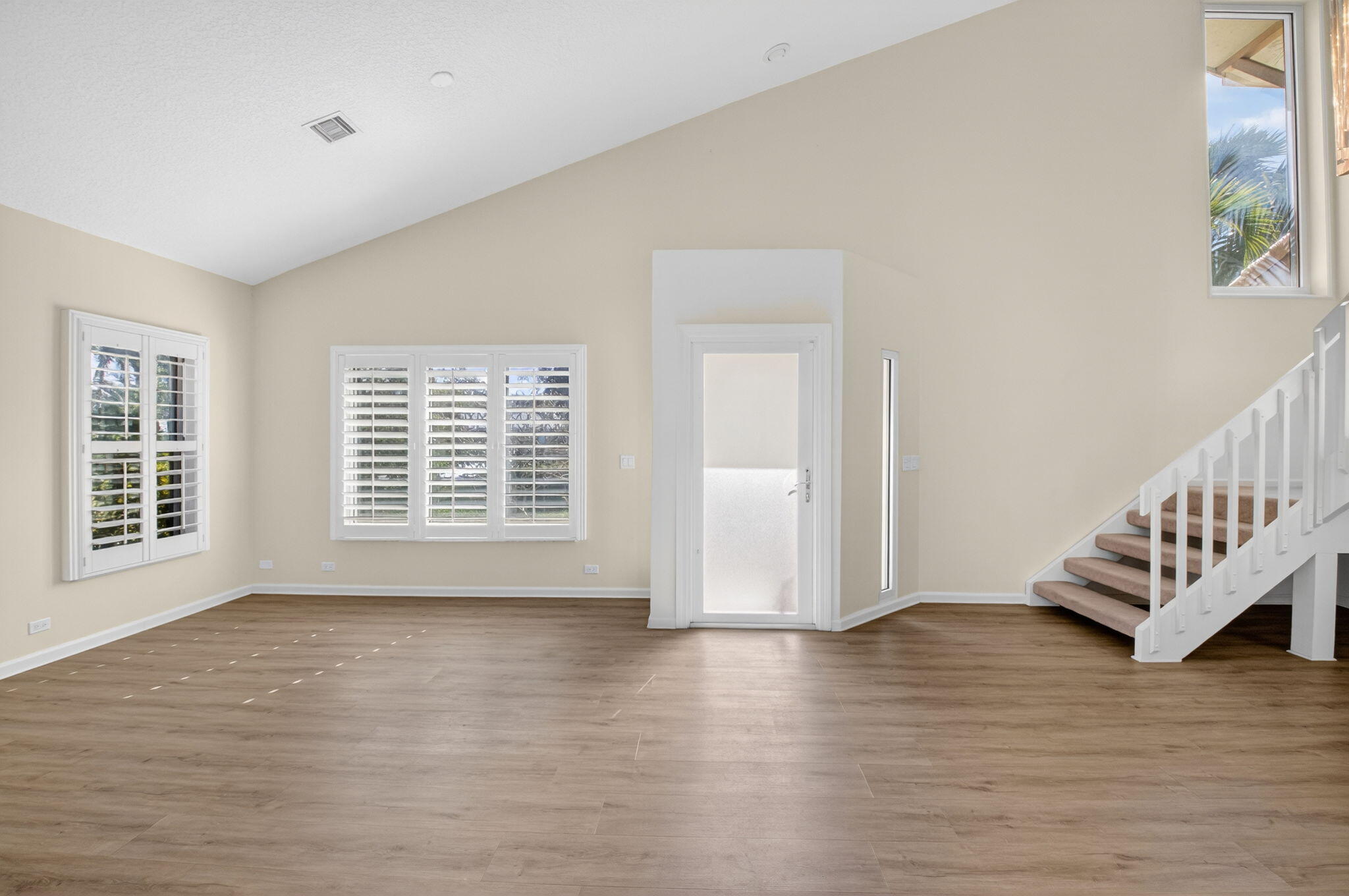 4517 Northwest 5th Avenue Boca Raton, FL 33431 - Photo 20 of 40 a view of an empty room with wooden floor and a window