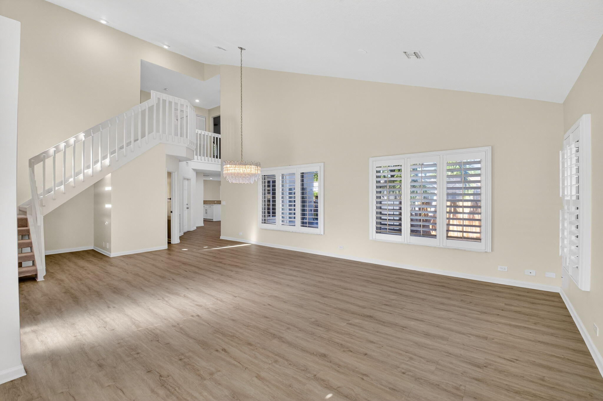 4517 Northwest 5th Avenue Boca Raton, FL 33431 - Photo 6 of 40 a view of an empty room with wooden floor and a window
