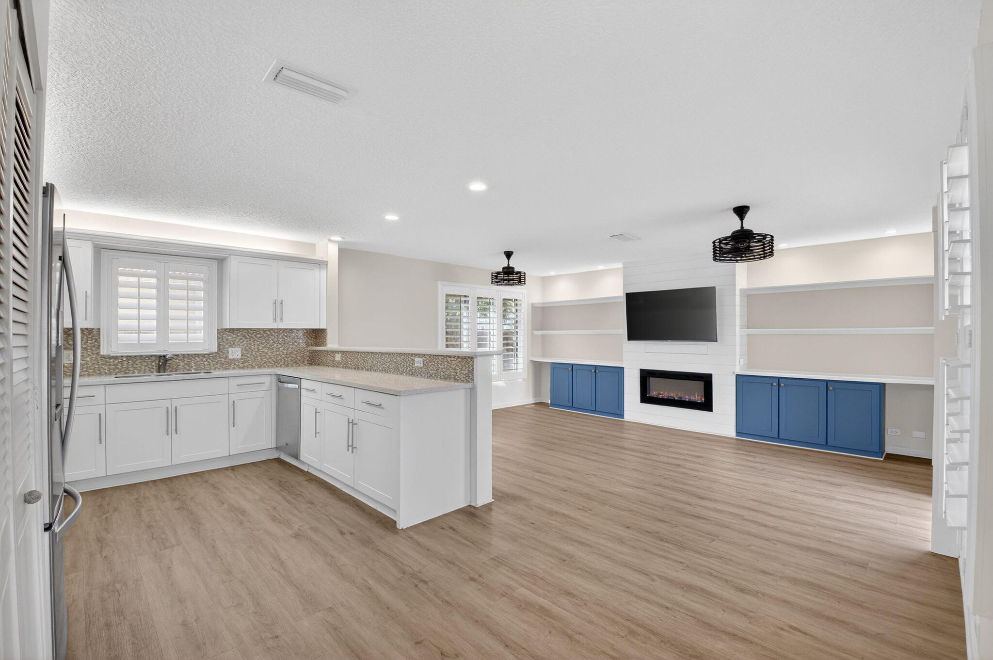 4517 Northwest 5th Avenue Boca Raton, FL 33431 - Photo 10 of 40 a large white kitchen with a stove top oven and sink