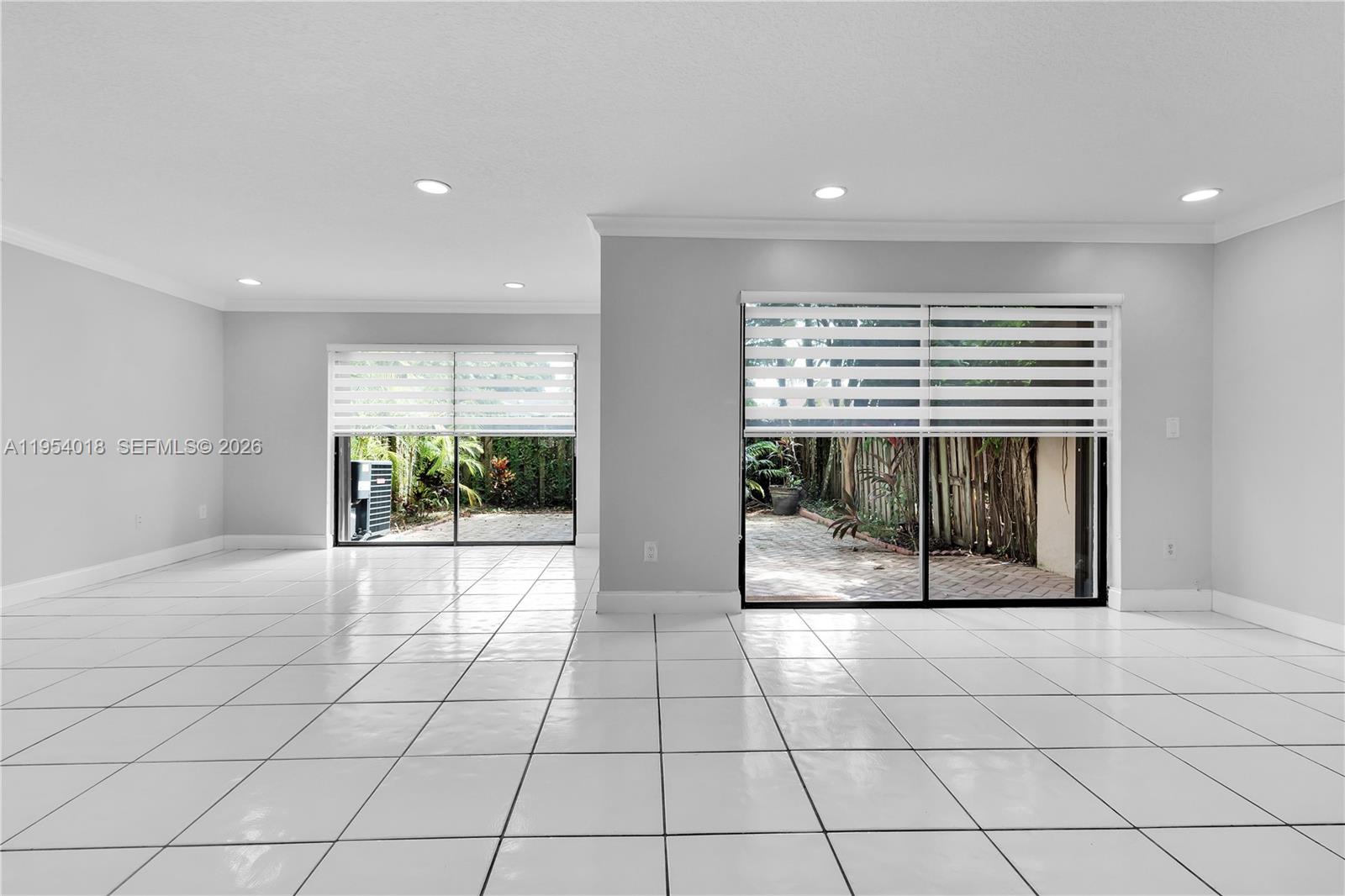 11668 Southwest 91st Terrace, Unit 11668 Miami, FL 33176 - Photo 18 of 39 a view of an empty room and window