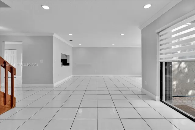 a view of an empty room and window