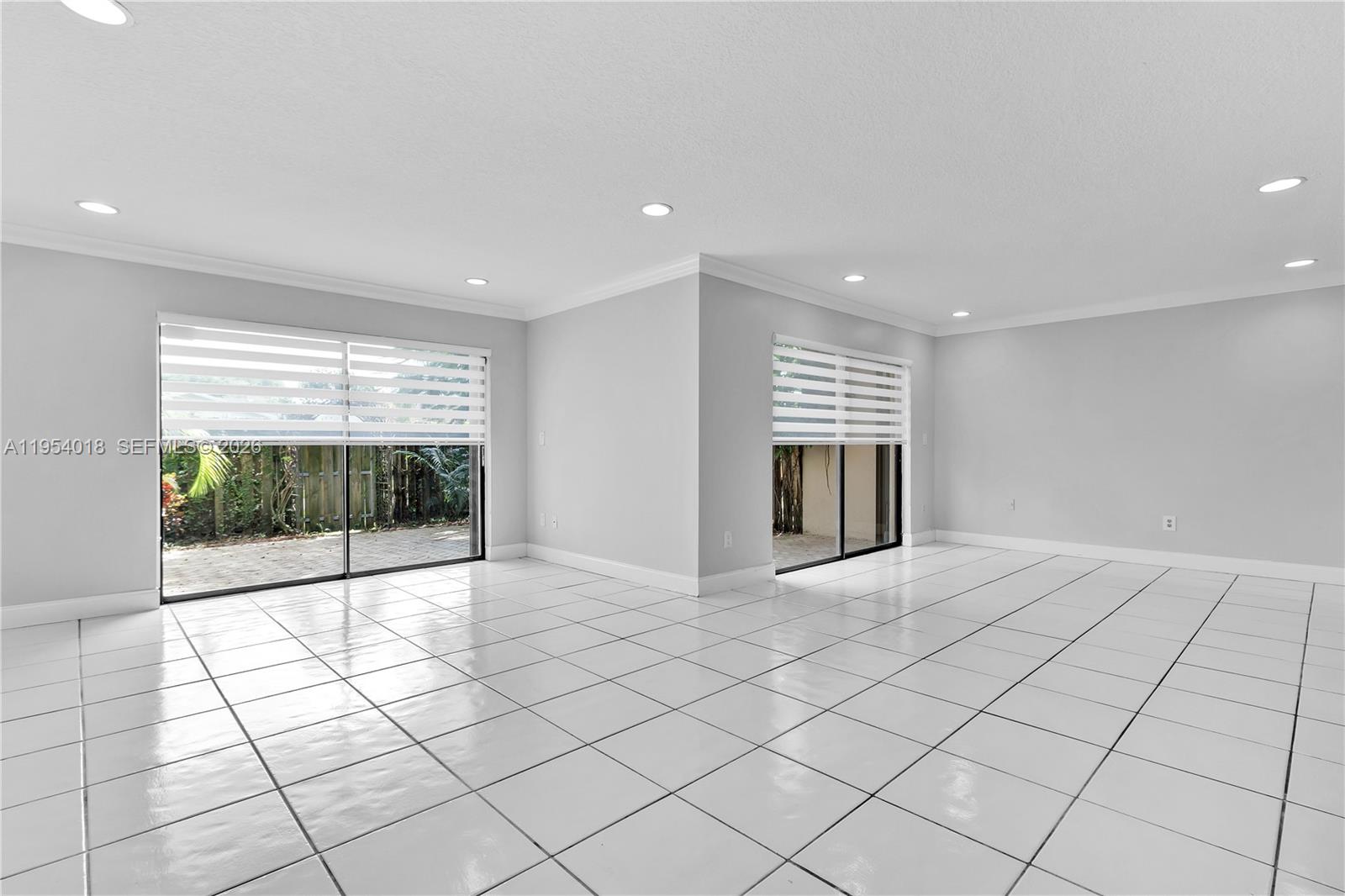 11668 Southwest 91st Terrace, Unit 11668 Miami, FL 33176 - Photo 22 of 39 a view of an empty room and window