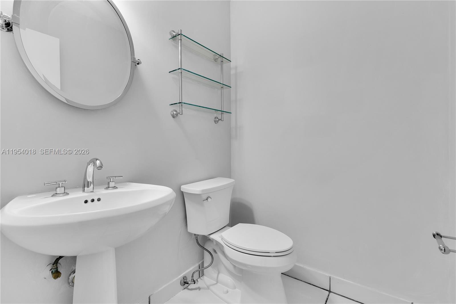 11668 Southwest 91st Terrace, Unit 11668 Miami, FL 33176 - Photo 26 of 39 a bathroom with a sink and a mirror