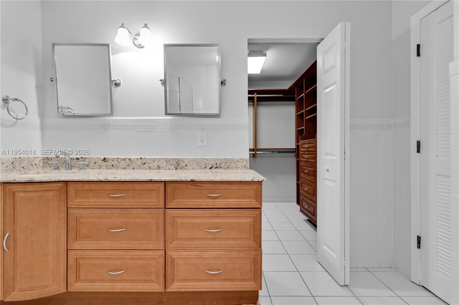 11668 Southwest 91st Terrace, Unit 11668 Miami, FL 33176 - Photo 38 of 39 a kitchen with a sink and cabinets