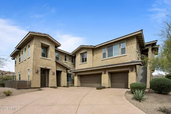 a front view of a house with yard
