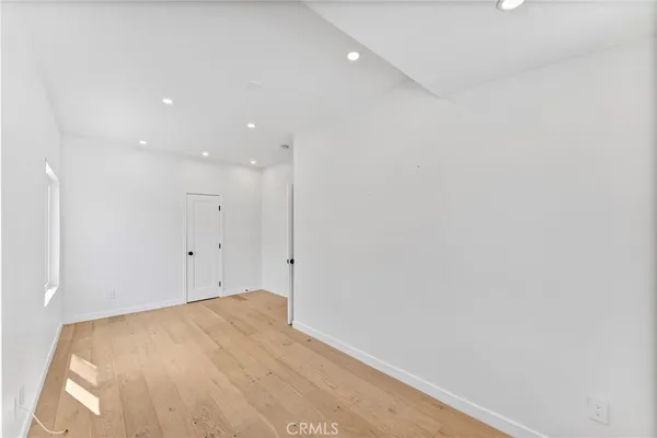 a bathroom with a granite countertop sink a toilet and a tub