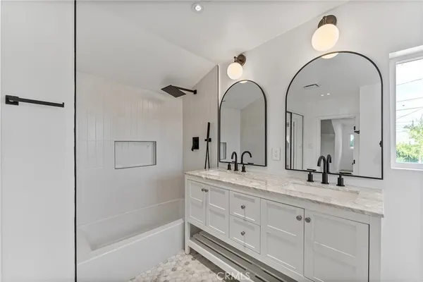 a bedroom with a bed and a shower