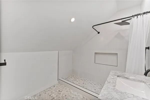 a bathroom with a double vanity sink and mirror