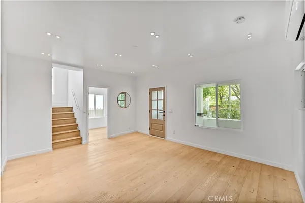 a large kitchen with stainless steel appliances granite countertop a sink and a stove