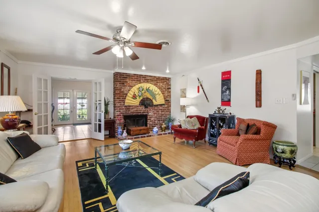 a living room with furniture or couch and a large window