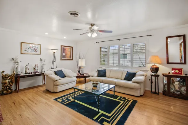 a living room with furniture rug and window