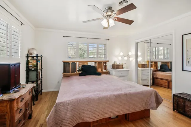 a bed room with a bed and a television