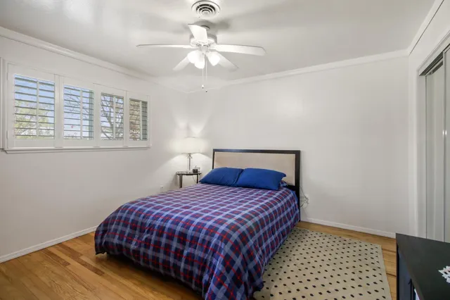 a bathroom with a sink mirror and toilet