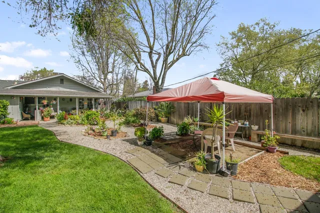 a front view of a house with a yard and porch