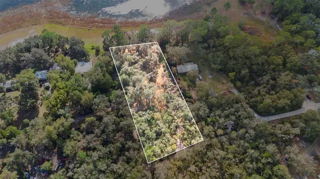 an aerial view of residential house with outdoor space