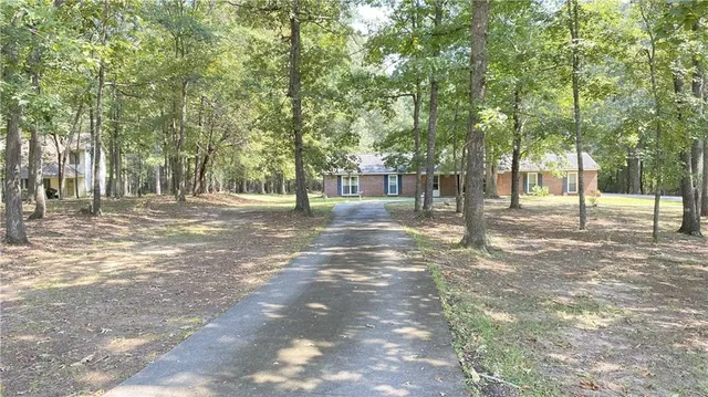 a backyard of a house with trees and houses