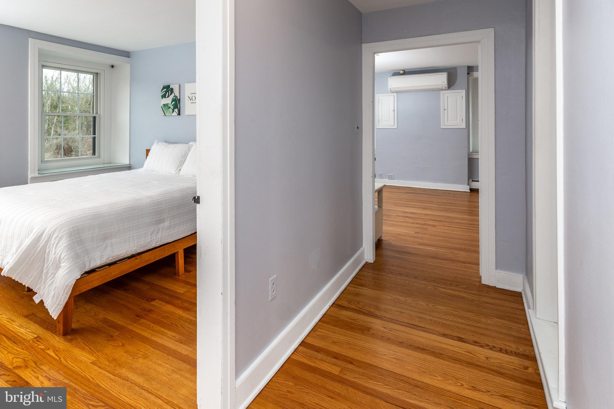 180 Municipal Road Pipersville, PA 18947 - Photo 49 of 60 a bedroom with a bed and wooden floor