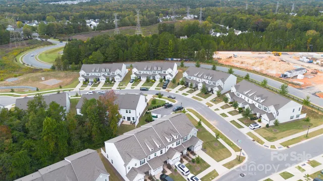 an aerial view of a house with a lake view