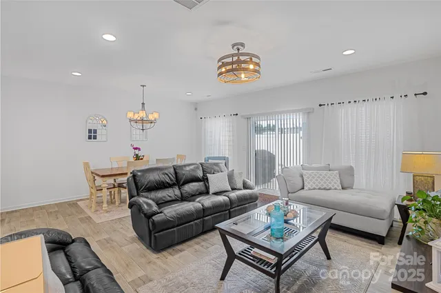 a living room with furniture and a table
