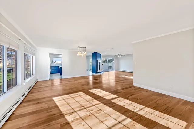 a kitchen with stainless steel appliances granite countertop a refrigerator and a stove