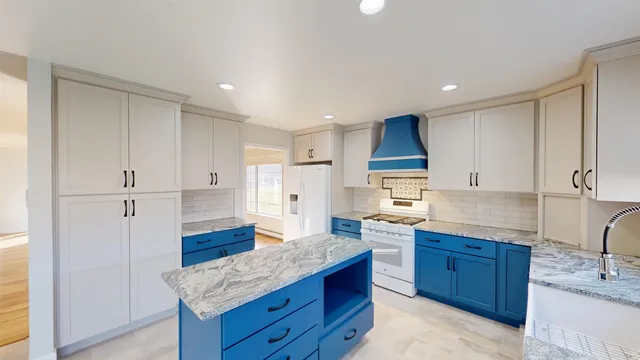 a kitchen with granite countertop a sink and a stove