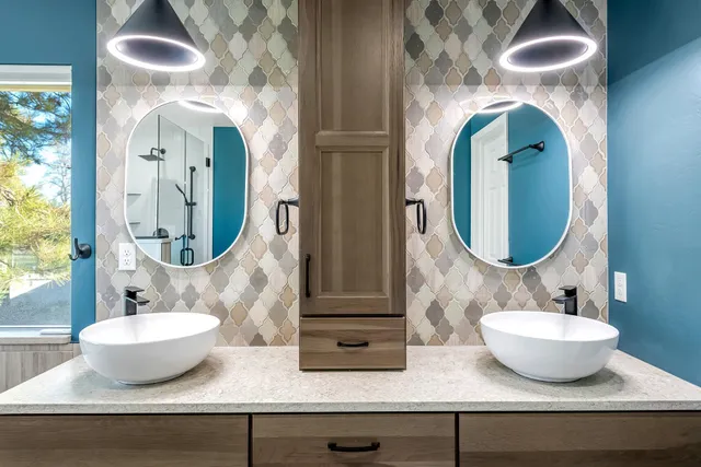 a spacious bathroom with a granite countertop sink and a mirror