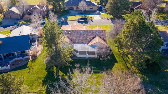 an aerial view of a house with a yard
