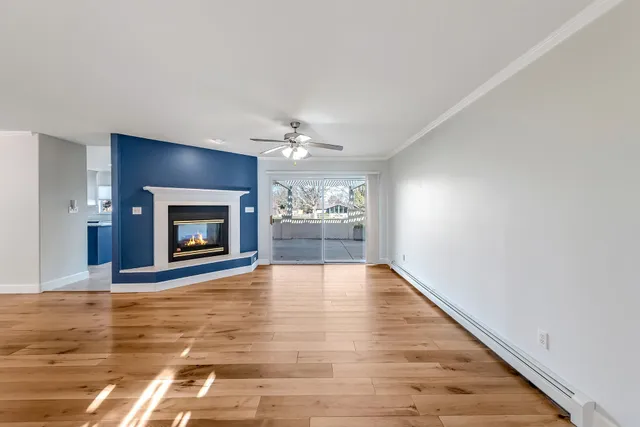 a view of an empty room and fire place