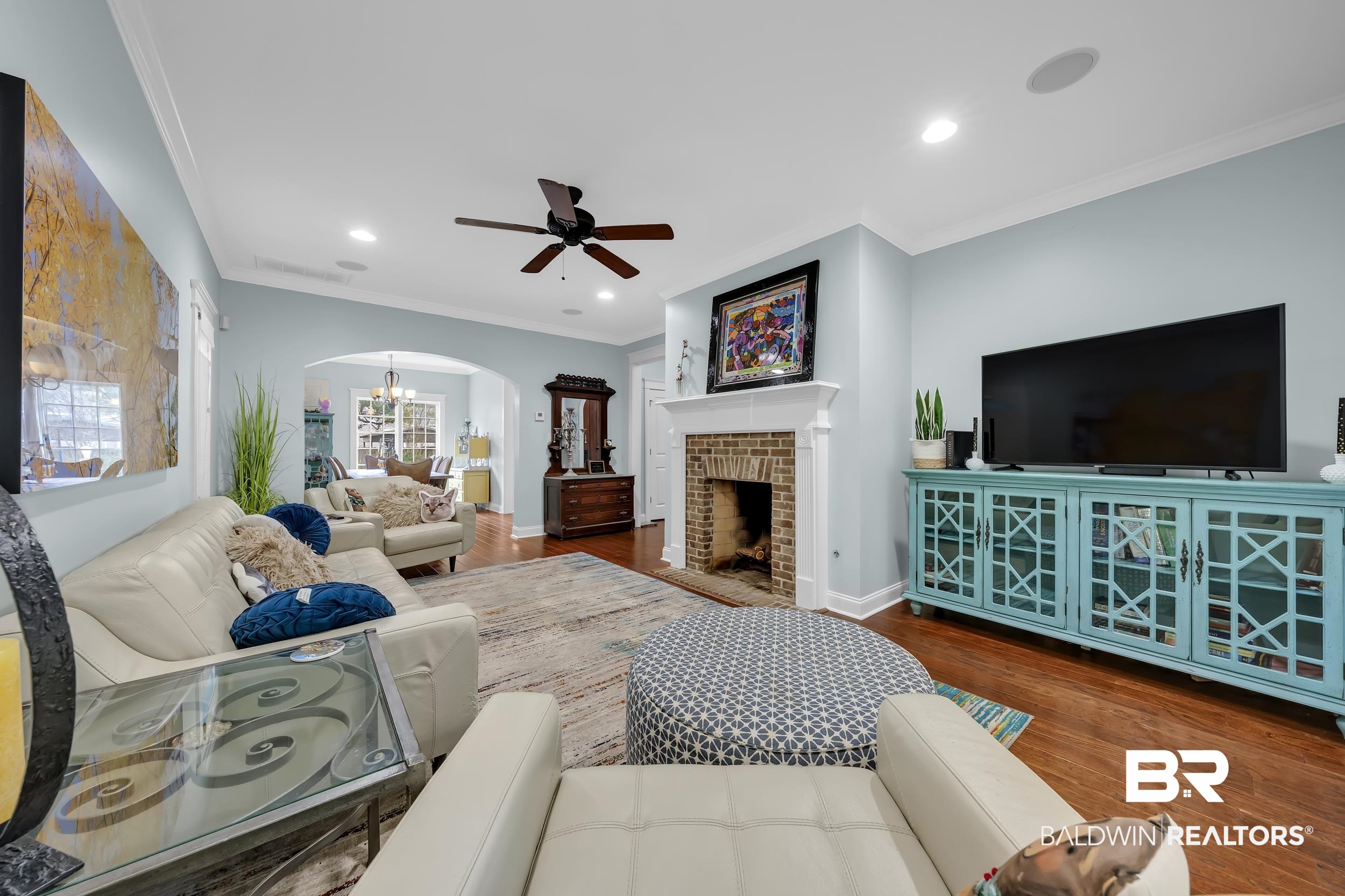 7 Bienville Avenue Mobile, AL 36606 - Photo 6 of 32 Living area featuring arched walkways, a chandelier, ornamental molding, recessed lighting, and ceiling fan
