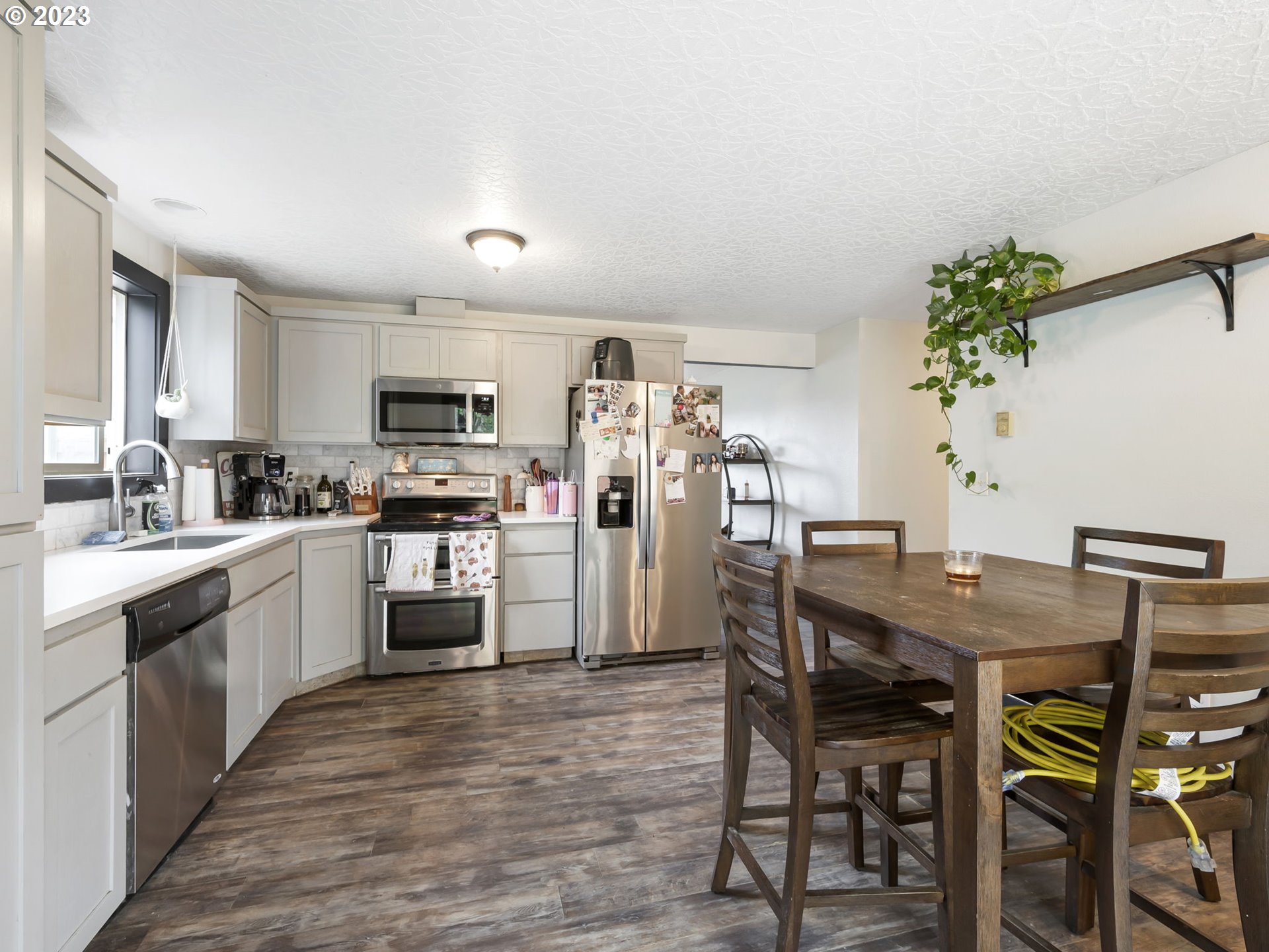 4413 Addy Loop Washougal, WA 98671 - Photo 11 of 28 a kitchen with a table and chairs in it