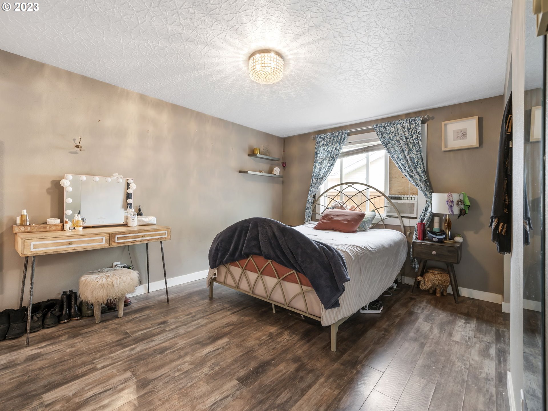 4413 Addy Loop Washougal, WA 98671 - Photo 12 of 28 a bedroom with a bed and wooden floor