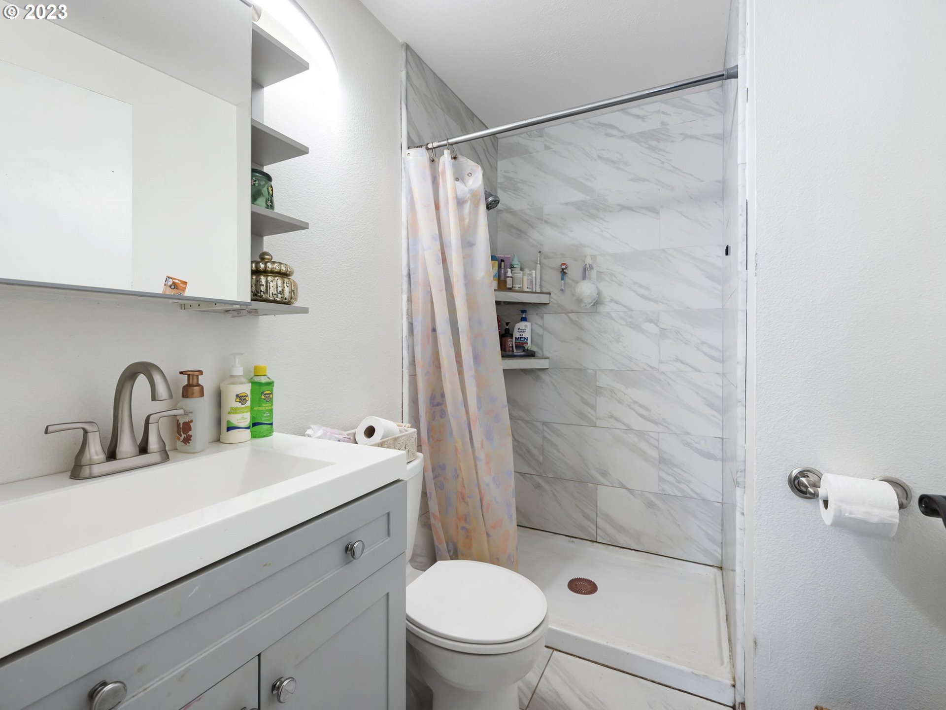 4413 Addy Loop Washougal, WA 98671 - Photo 14 of 28 a bathroom with a sink a toilet and shower