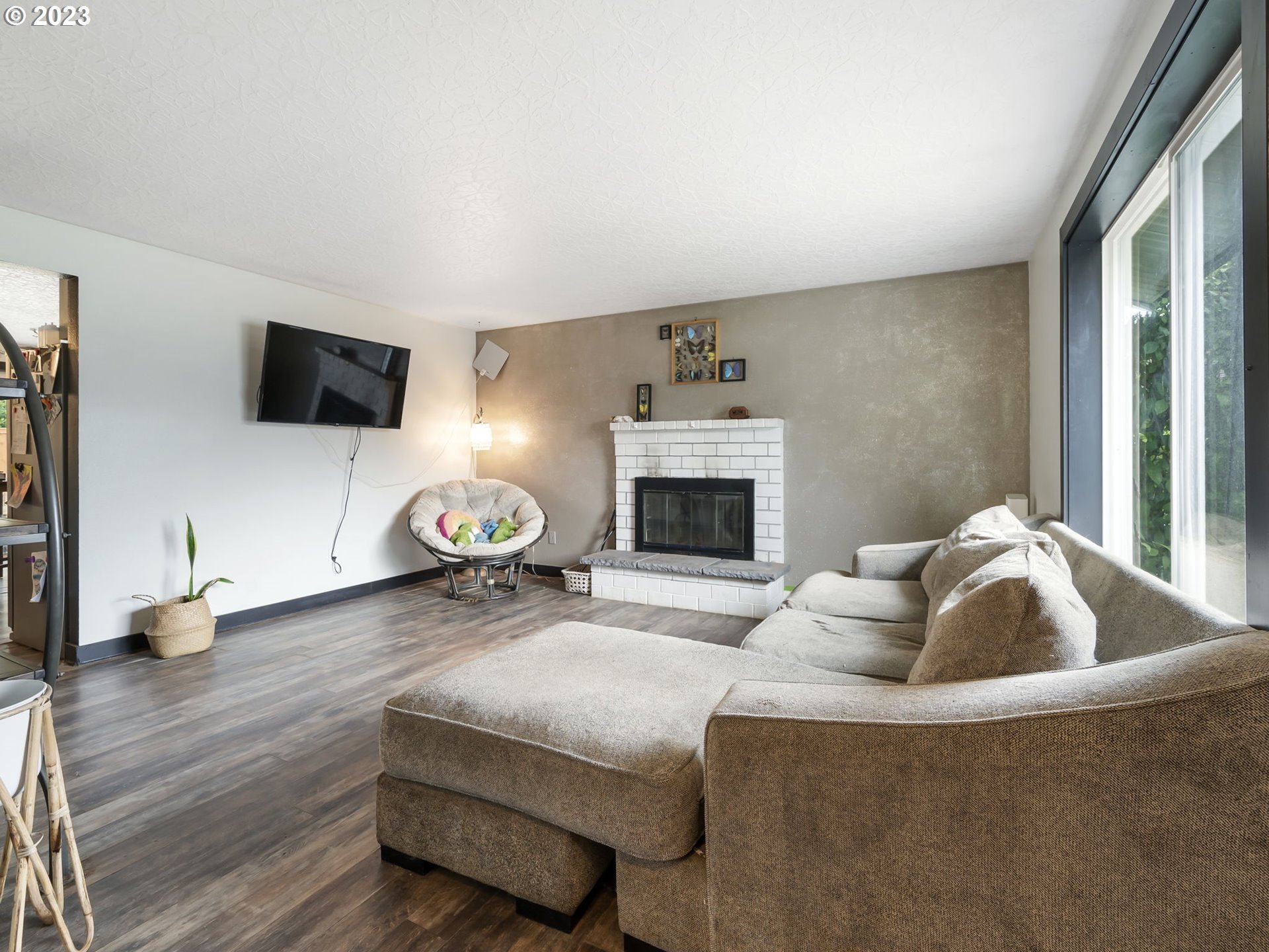 4413 Addy Loop Washougal, WA 98671 - Photo 2 of 28 a living room with furniture and a fireplace