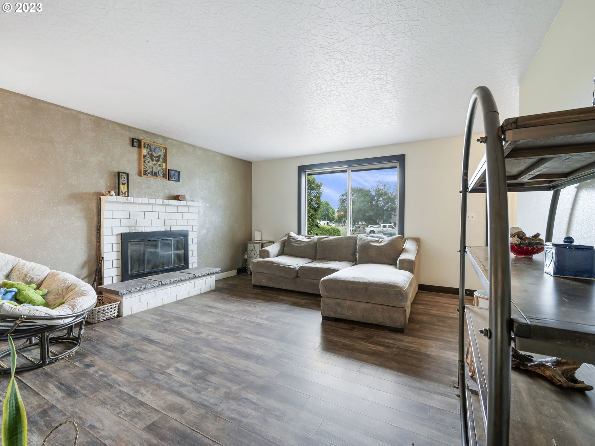 4413 Addy Loop Washougal, WA 98671 - Photo 4 of 28 a living room with furniture and a fireplace
