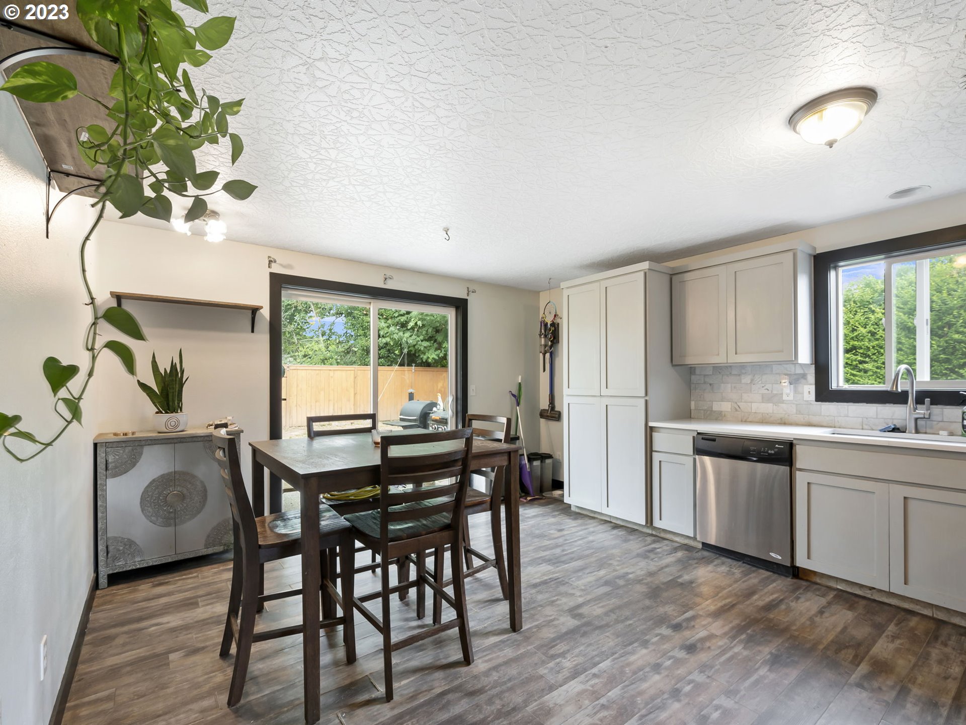 4413 Addy Loop Washougal, WA 98671 - Photo 5 of 28 a view of a dining room with furniture window and wooden floor