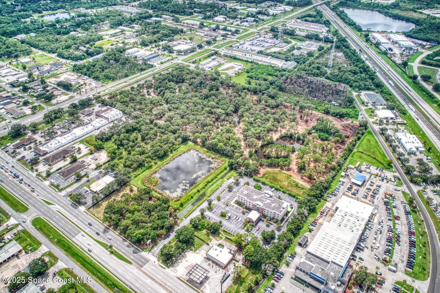 1206 Malabar Road Palm Bay, FL 32909 - Photo 14 of 15 an aerial view of residential houses with outdoor space