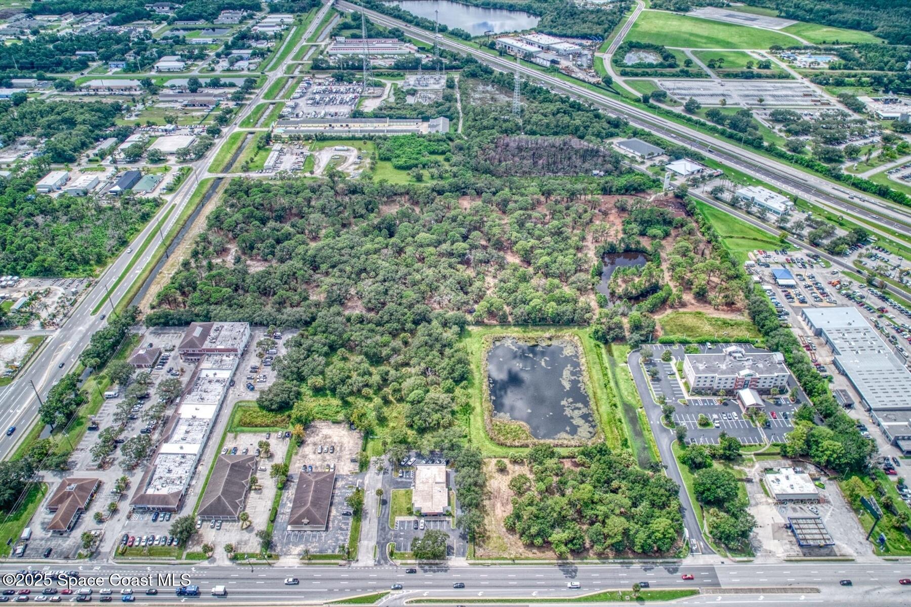 1206 Malabar Road Palm Bay, FL 32909 - Photo 15 of 15 a aerial view of a city
