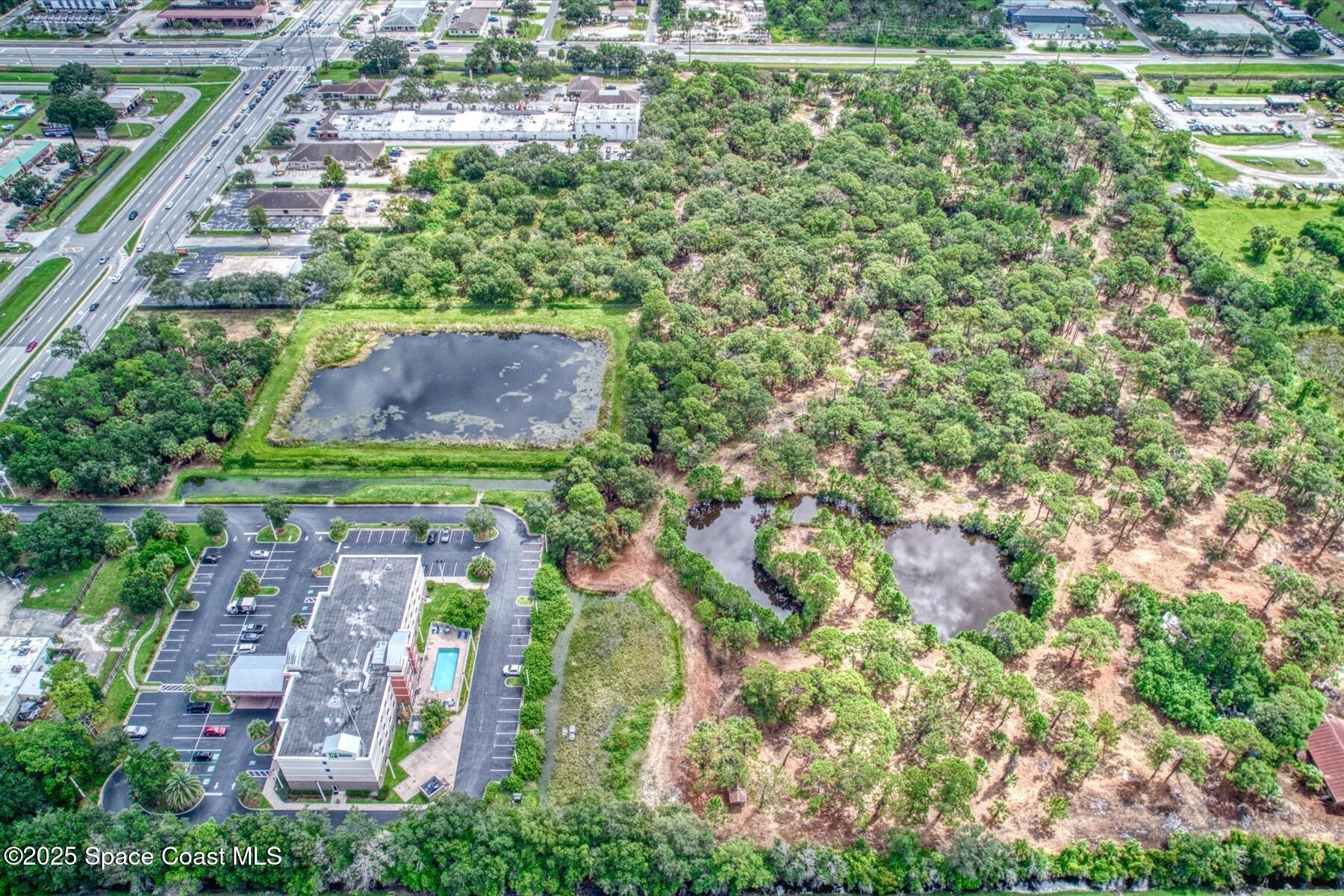 1206 Malabar Road Palm Bay, FL 32909 - Photo 10 of 15 an aerial view of residential houses with outdoor space and trees