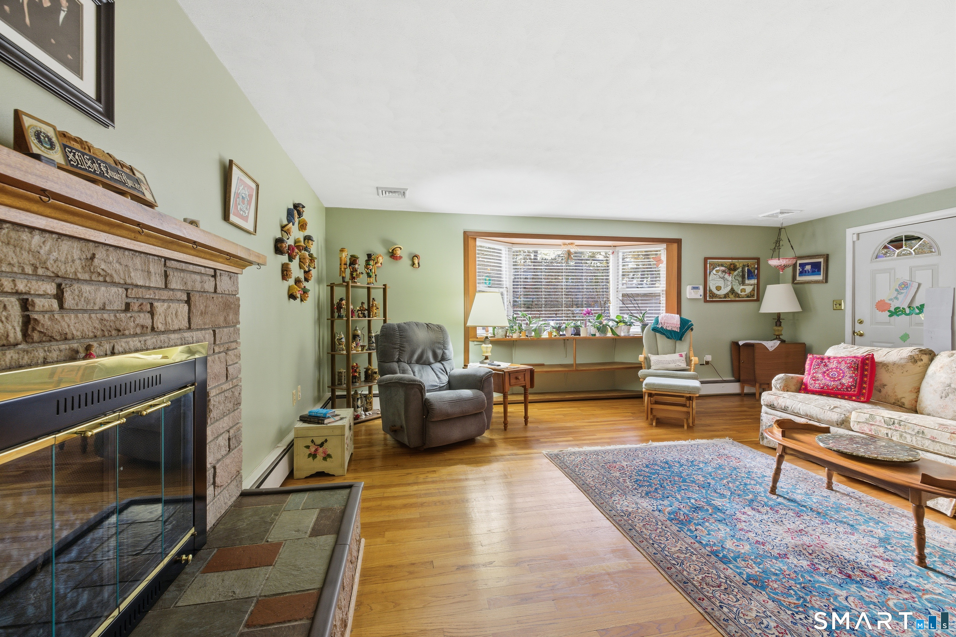 32 Richard Road Ledyard, CT 06335 - Photo 11 of 32 a living room with furniture and a fireplace