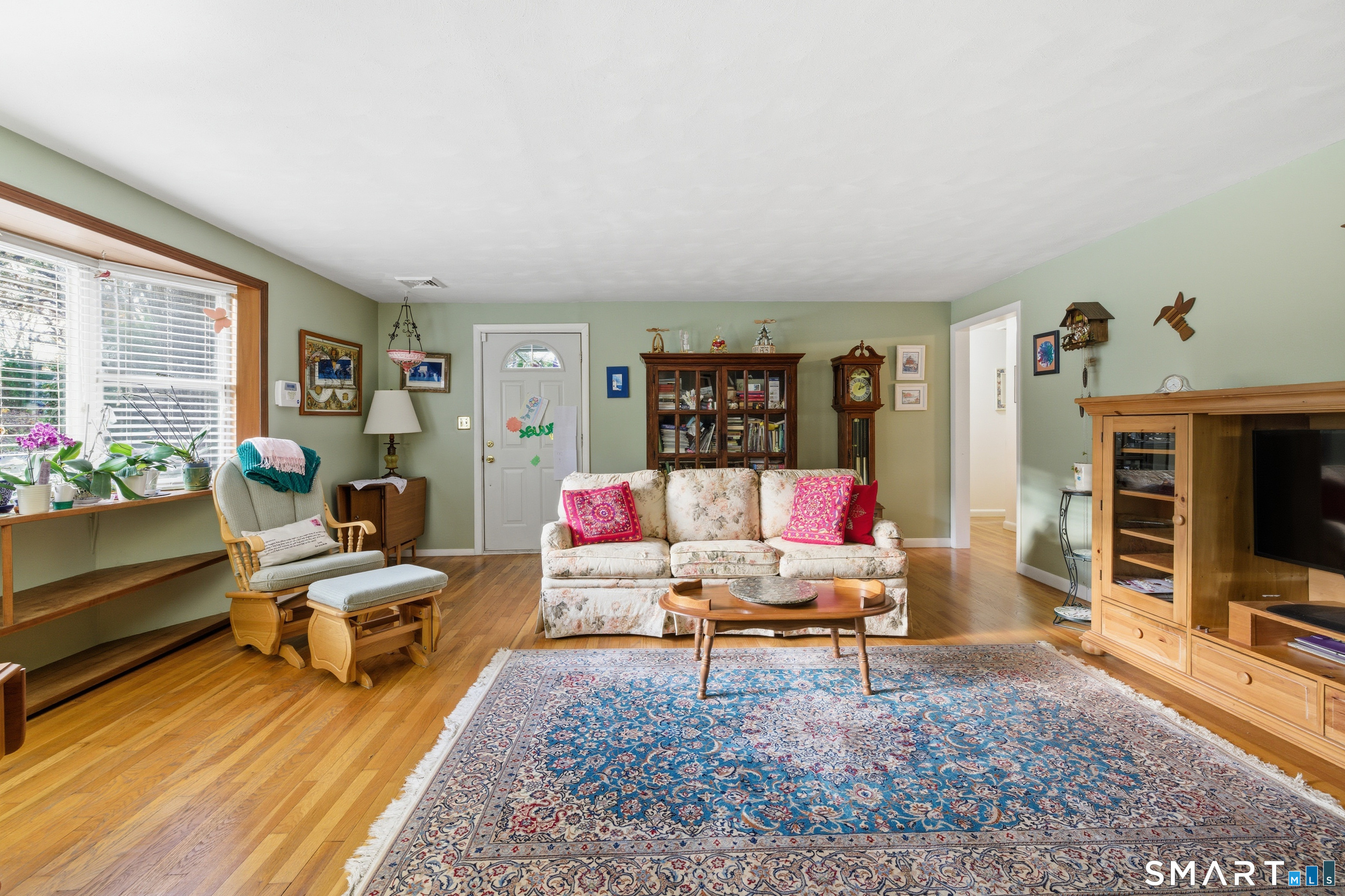 32 Richard Road Ledyard, CT 06335 - Photo 12 of 32 a living room with furniture and a flat screen tv