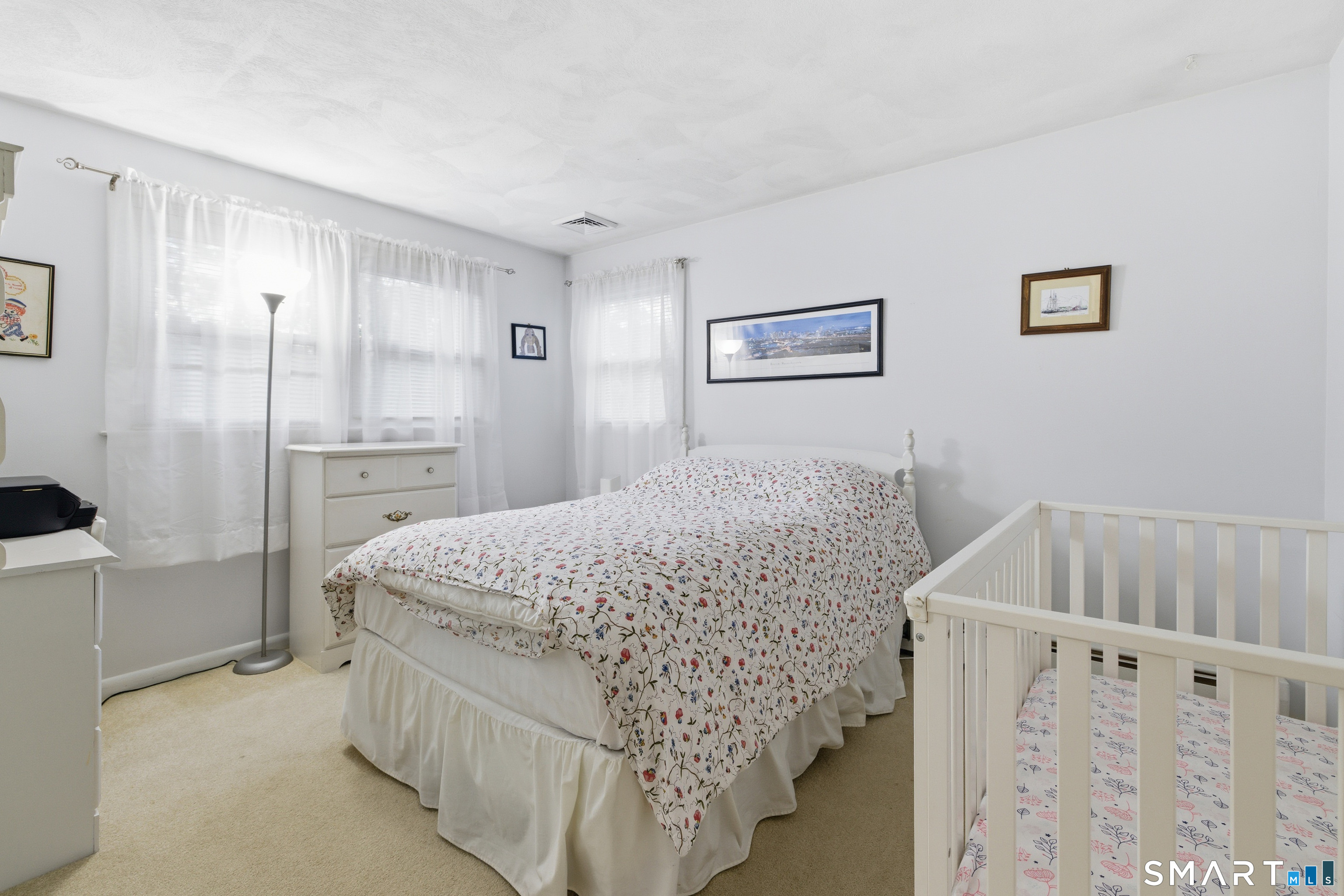 32 Richard Road Ledyard, CT 06335 - Photo 17 of 32 a bed room with a bed and a refrigerator