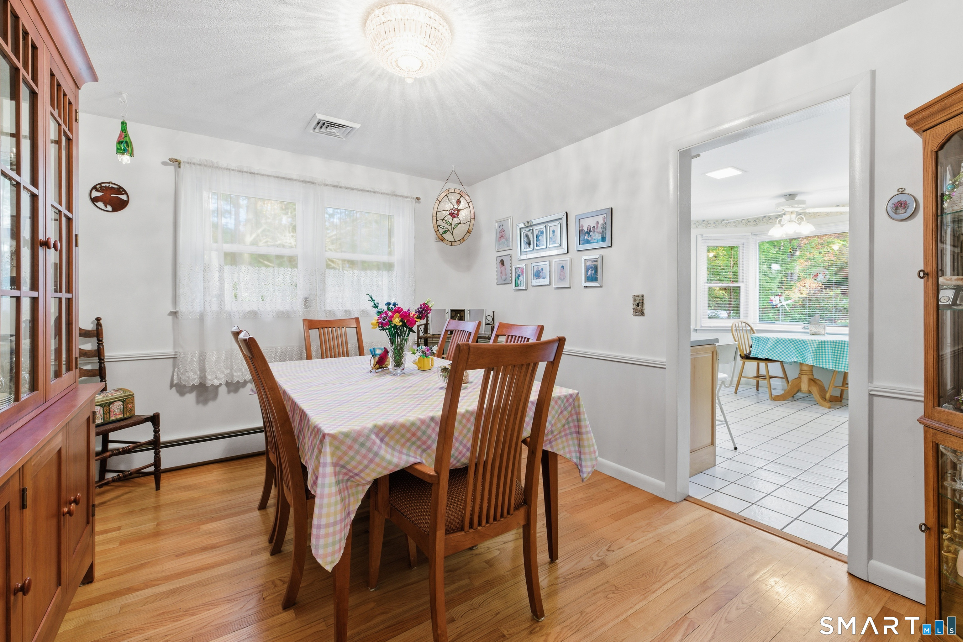 32 Richard Road Ledyard, CT 06335 - Photo 19 of 32 a view of a dining room with furniture and wooden floor